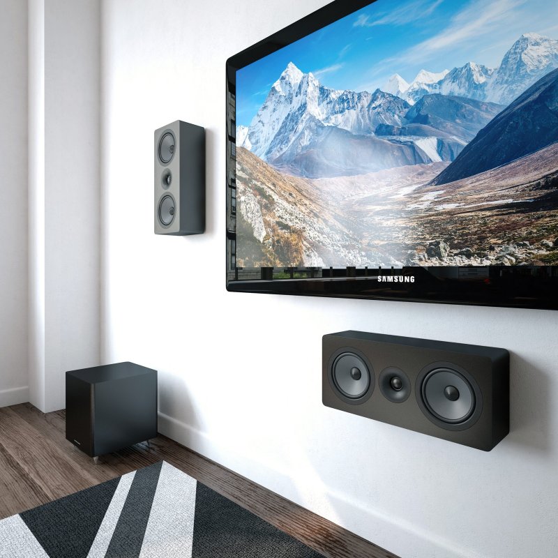 Acoustic Energy AE105 + AESub 2.1 Speaker Pack Black: two AE105 on-wall speakers and AE Sub subwoofer in a living room, grilles off