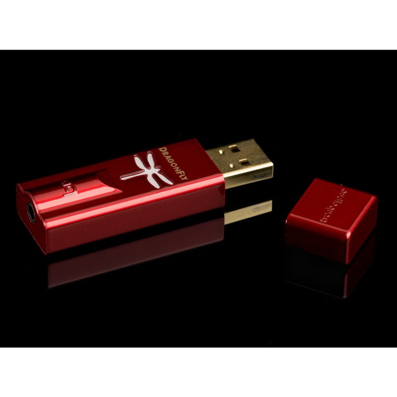 AudioQuest DragonFly Red USB DAC with protective cap on black background