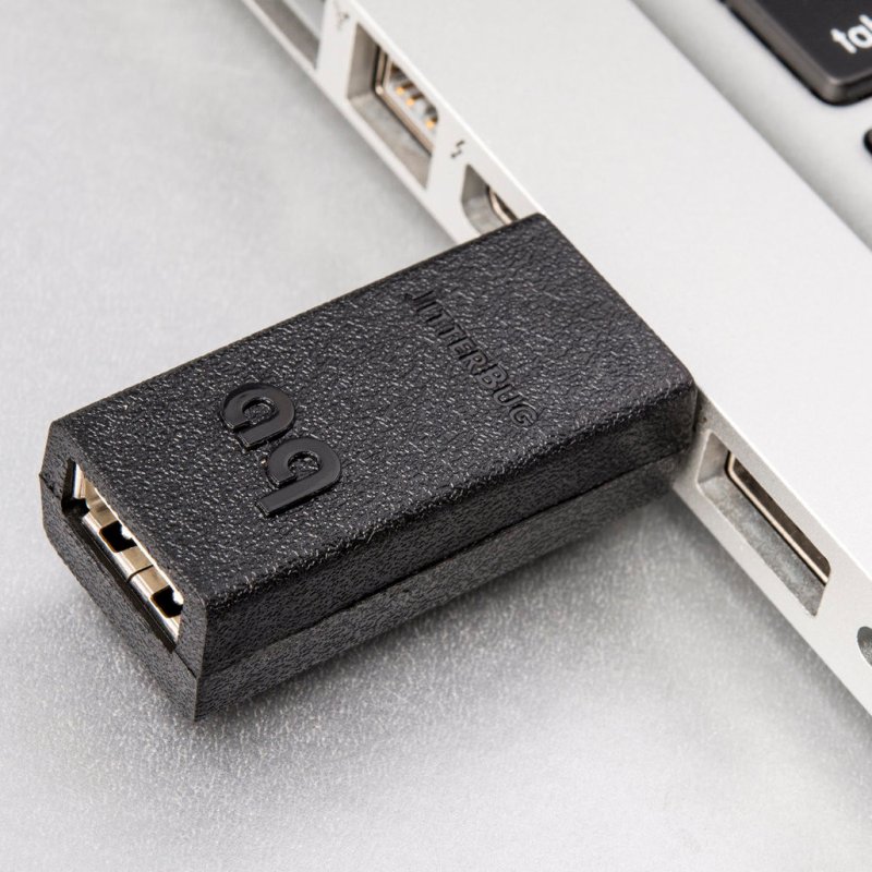 AudioQuest JitterBug plugged into laptop USB port - lifestyle shot