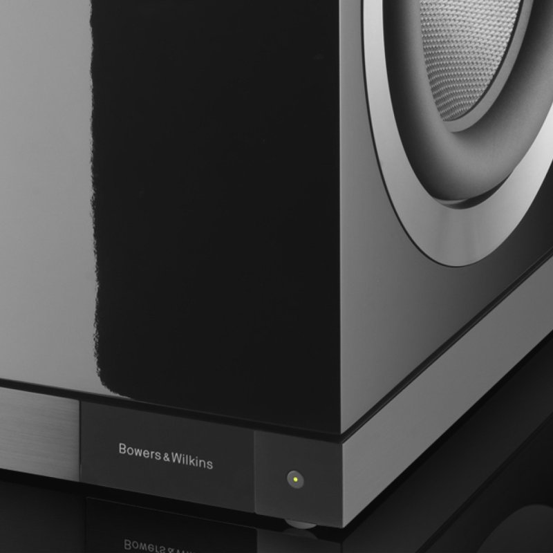 Bowers & Wilkins DB1D Active Subwoofer Gloss Black — driver and badge close-up