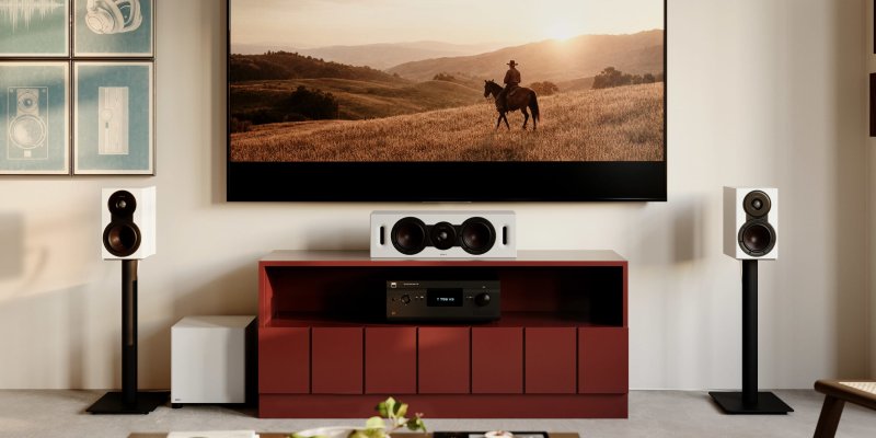 DALI BASIK SUB in Solid White beside a red media cabinet below a wall mounted TV