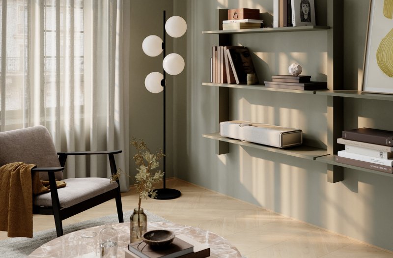 DALI VEGA Natural Oak on a shelf in a living room