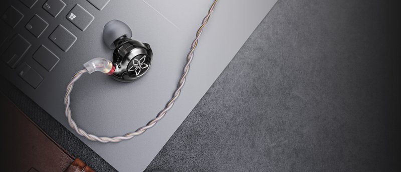 FiiO FH11 lifestyle shot on laptop