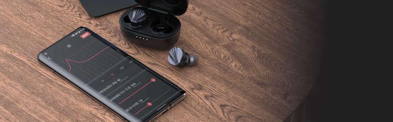 FiiO FW5 - earphones and case on desk lifestyle