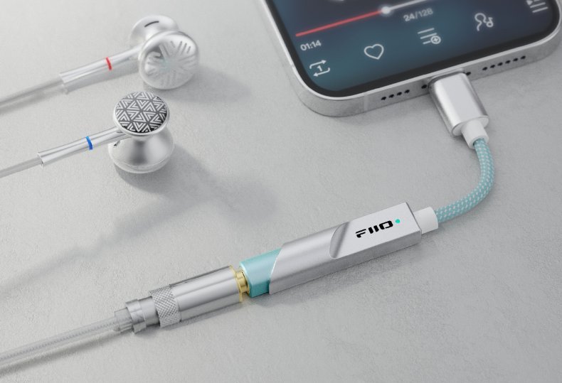 FiiO KA11 USB-C Silver plugged into a smartphone with earphones