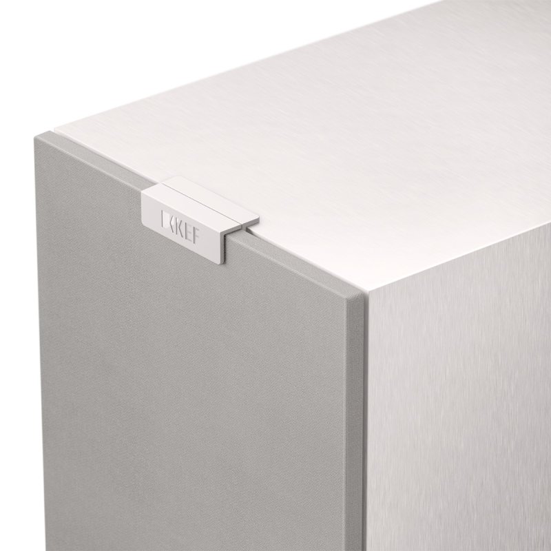 KEF Q1 Meta Bookshelf Speaker in Satin White, close-up detail of the magnetic fabric grille and cabinet finish
