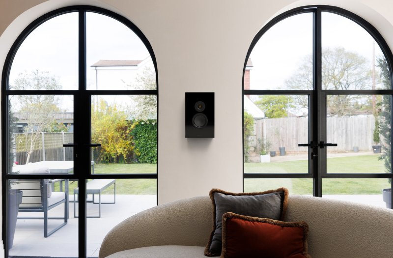 Monitor Audio Silver On-Wall 8G High Gloss Black wall mounted in a living room