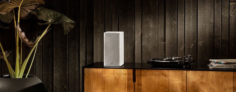 Polk Audio Reserve R100 Bookshelf Speakers White (Pair) — lifestyle on sideboard