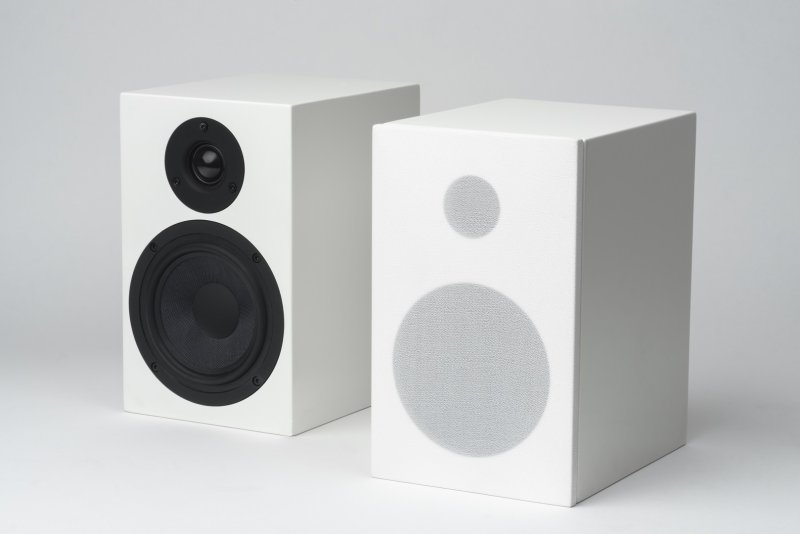 Pro-Ject Speaker Box 5 pair, white, one with grille fitted, studio shot