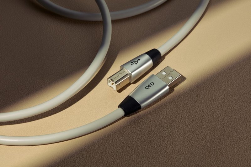 QED Performance USB cable coiled, close-up of the Type-A and Type-B plugs