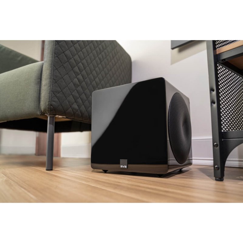 SVS 3000 Micro Subwoofer in Gloss Black lifestyle view in living room beside sofa