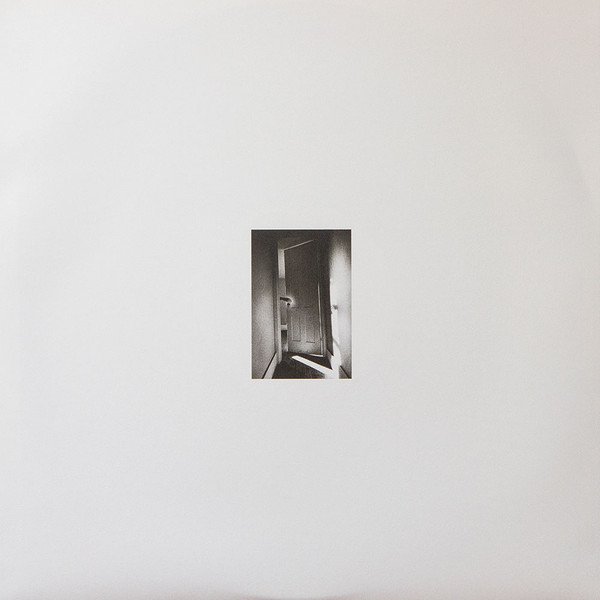 Printed inner sleeve front with doorway photograph