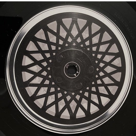 Kendrick Lamar GNX black vinyl side two label, printed with the GNX alloy wheel design