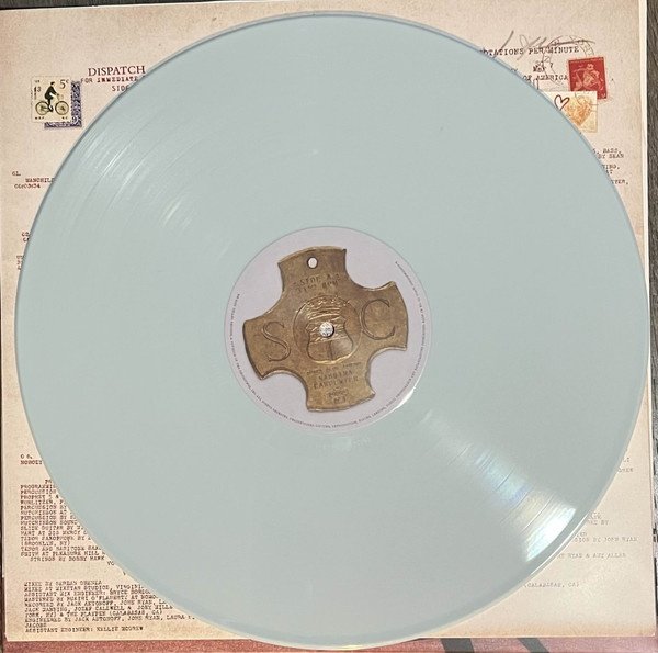 Opaque light blue vinyl LP with the side A label